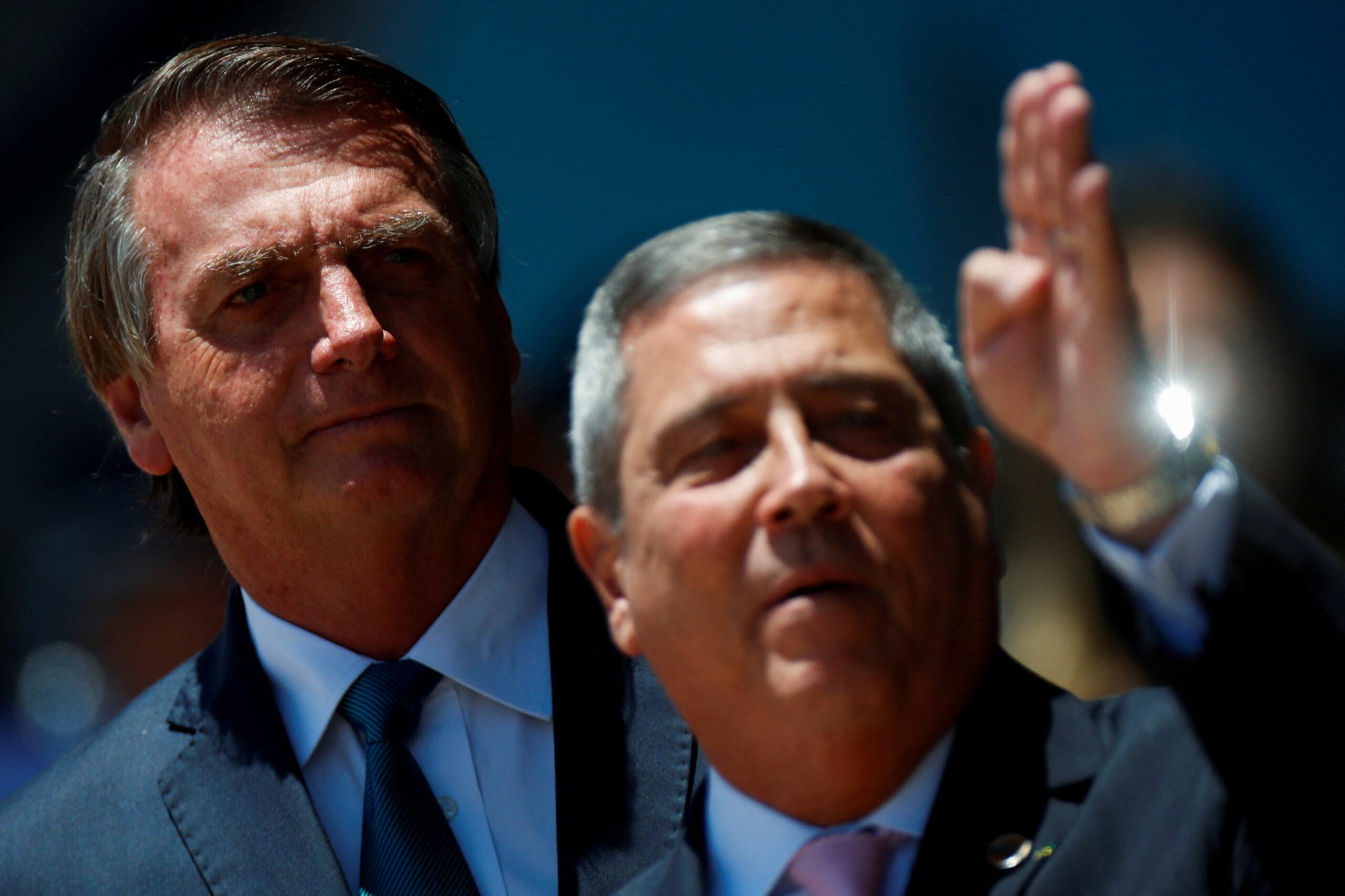 FILE PHOTO: Brazil's President Jair Bolsonaro looks on next to Brazil's Defense Minister Walter Souza Braga Netto during a welcome ceremony to receive the Brazilians and foreigners evacuated from Ukraine during the mission of repatriation, at the Brasilia Air Base, in Brasilia, Brazil March 10, 2022. REUTERS/Adriano Machado/File Photo
BOLSONARO BRAGA NETTO