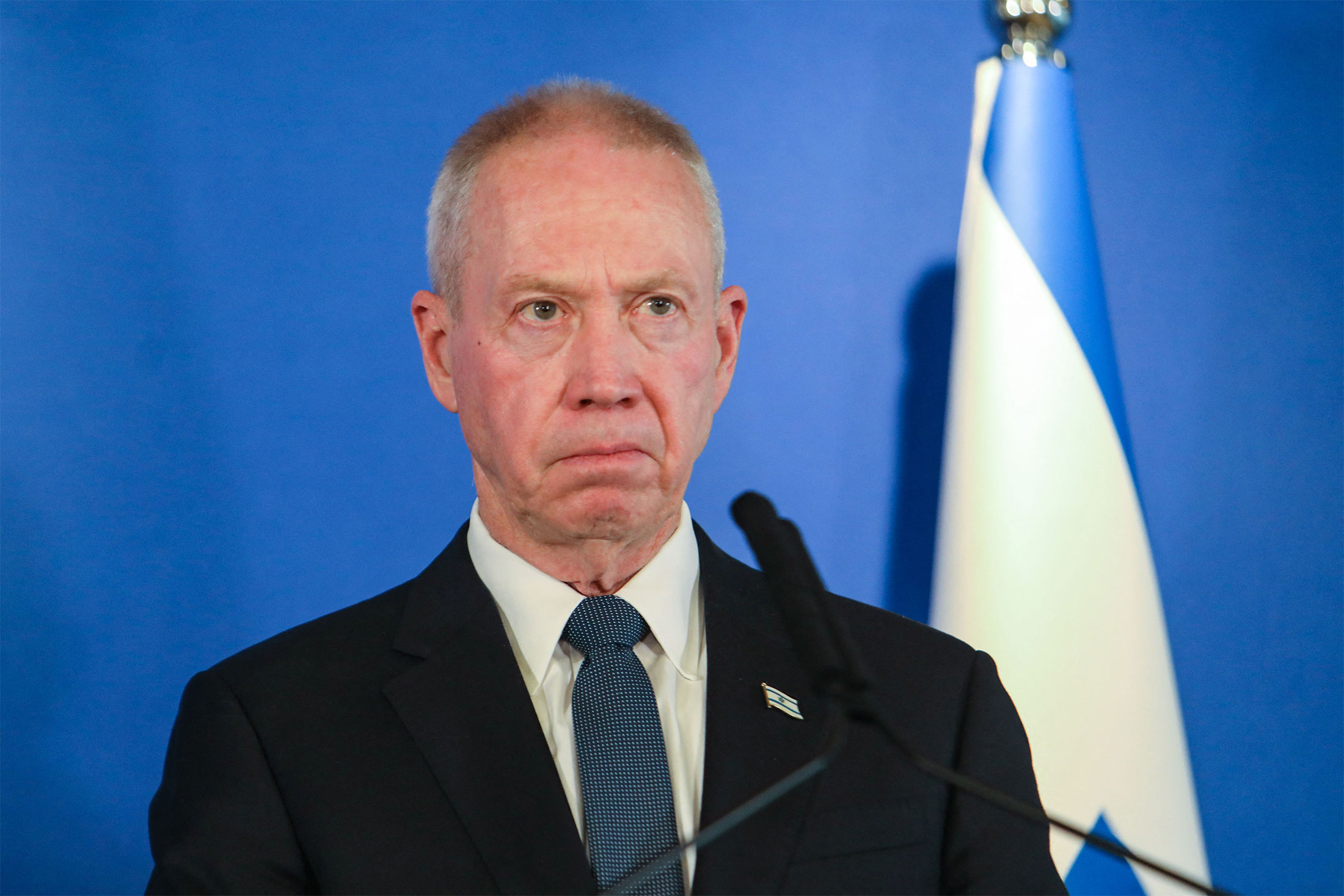 Israeli Minister of Defence Yoav Gallant delivers a statement to the press at the Israel Aerospace Industries (IAI) headquarters near the Ben Gurion airport in Tel Aviv, on March 9, 2023. - Austin, on a visit to Israel, expressed concerns on March 9 about Jewish settler violence against Palestinians and warned against acts that could trigger more insecurity. (Photo by GIL COHEN-MAGEN / AFP) (Photo by GIL COHEN-MAGEN/AFP via Getty Images)