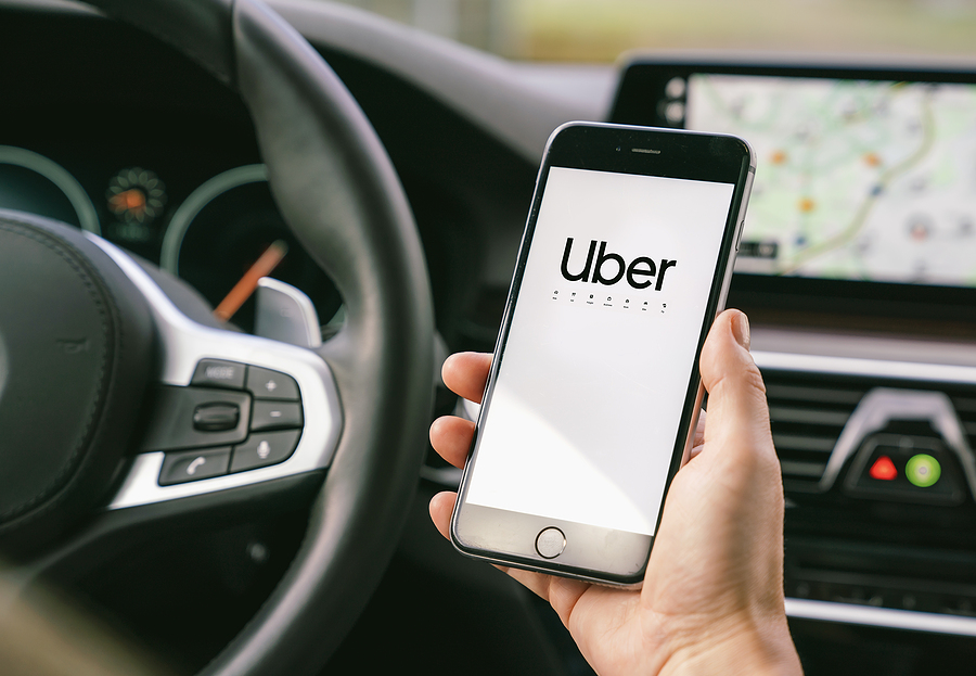 bigstock-Uber-Driver-Holding-Smartphone-345479947