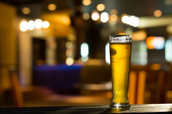 depositphotos_55007845-stock-photo-glass-of-beer-on-bar